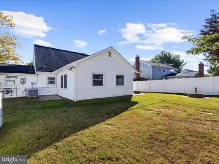 a view of a backyard with plants and a garden