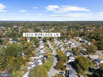 an aerial view of residential building with parking space