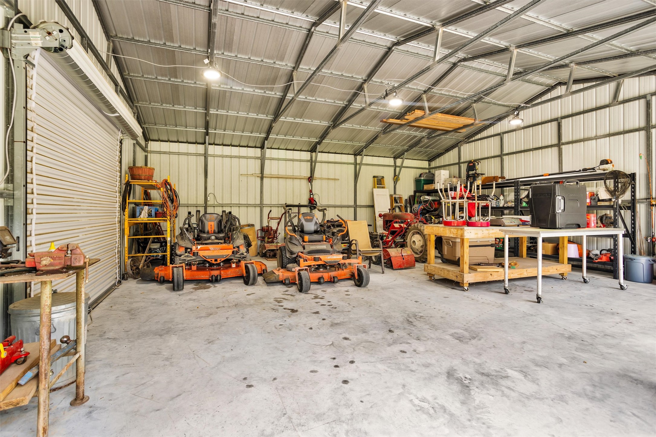 4402 Spears Road Manvel, TX 77578 - Photo 9 of 38 a view of a garage with a table and chairs