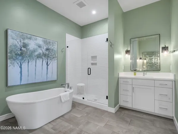 a bathroom with a bathtub and a shower