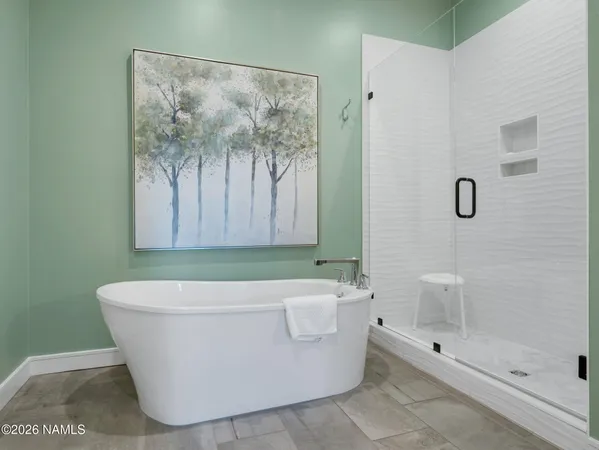 a white bath tub sitting in a bathroom