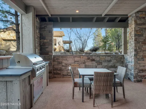 a kitchen with a table chairs and a stove