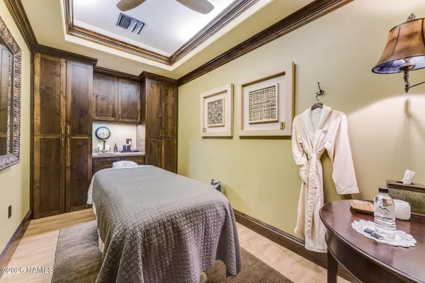 a bedroom with a bed and a table