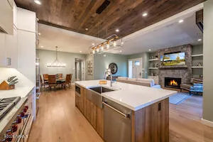 a kitchen with sink and a stove top oven