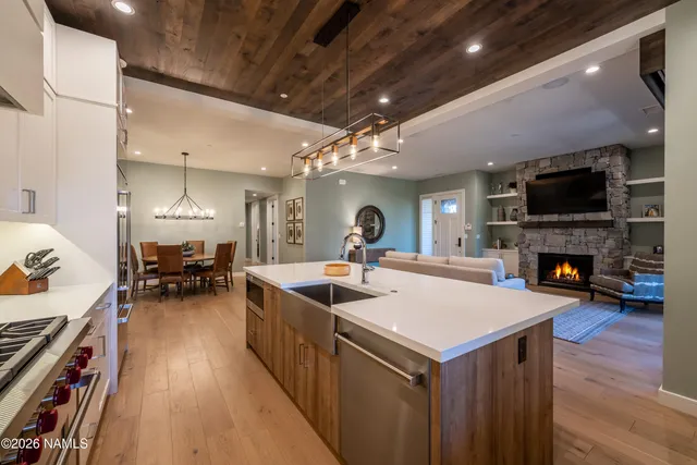 a kitchen with sink stove and cabinets