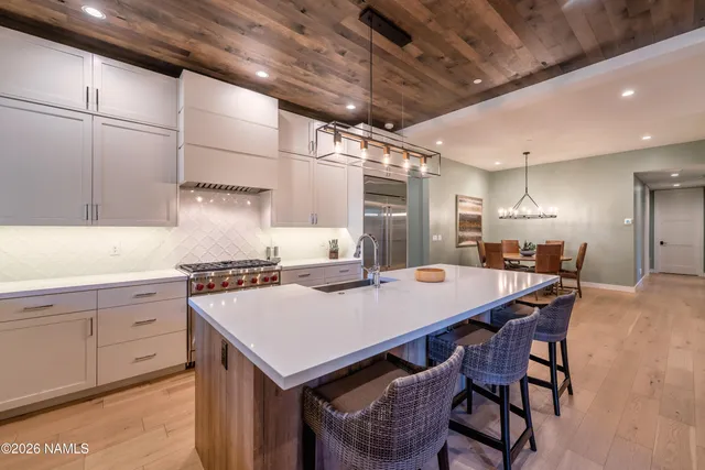 a kitchen with a table and chairs in it