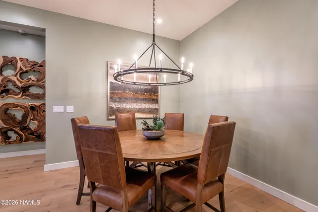 a view of a dining room with furniture and window