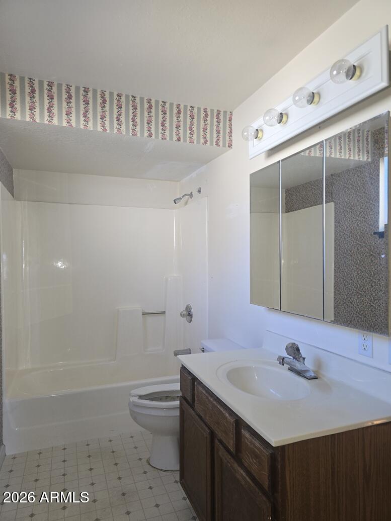 103 South Mc Lane Road Payson, AZ 85541 - Photo 11 of 26 a bathroom with a sink a toilet and a mirror