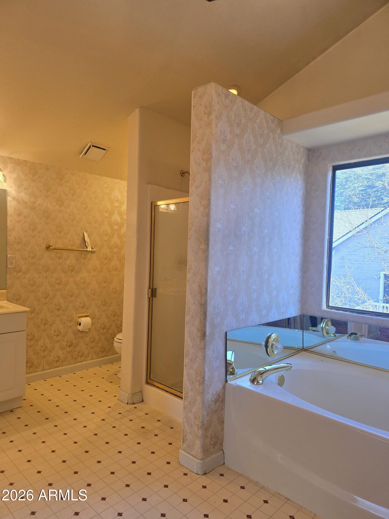 103 South Mc Lane Road Payson, AZ 85541 - Photo 17 of 26 a bathroom with a bathtub and a shower