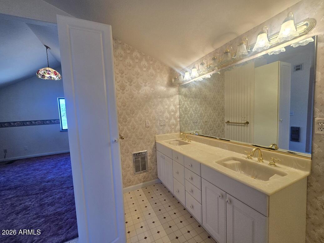 103 South Mc Lane Road Payson, AZ 85541 - Photo 18 of 26 a bathroom with a double vanity sink and a mirror