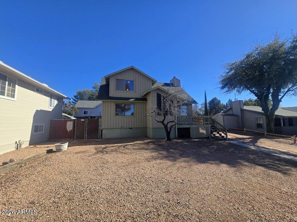 103 South Mc Lane Road Payson, AZ 85541 - Photo 21 of 26 a front view of a house with a yard and garage