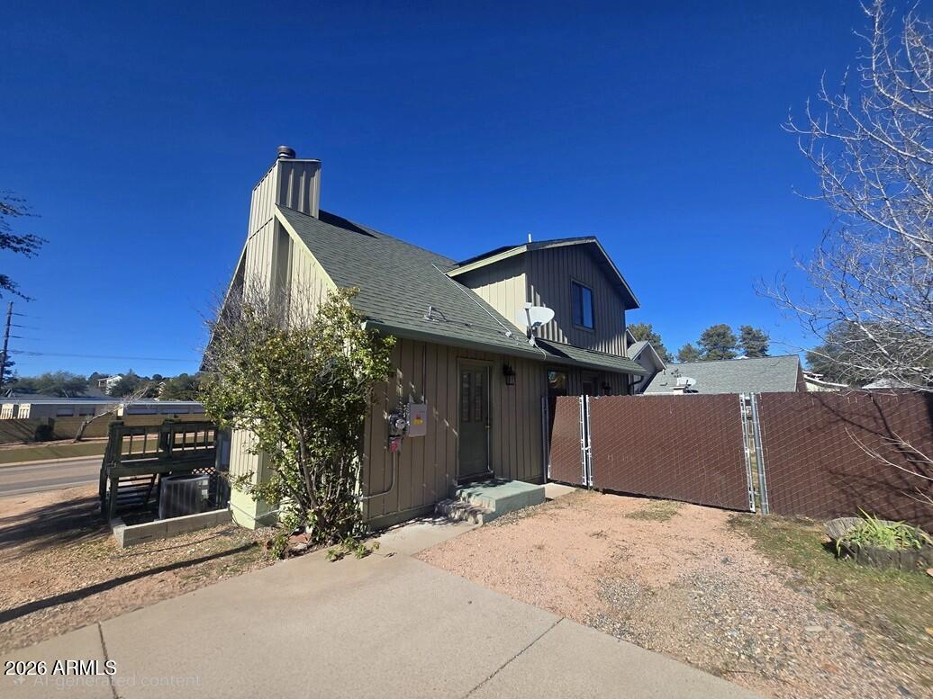 103 South Mc Lane Road Payson, AZ 85541 - Photo 22 of 26 a front view of a house with a yard