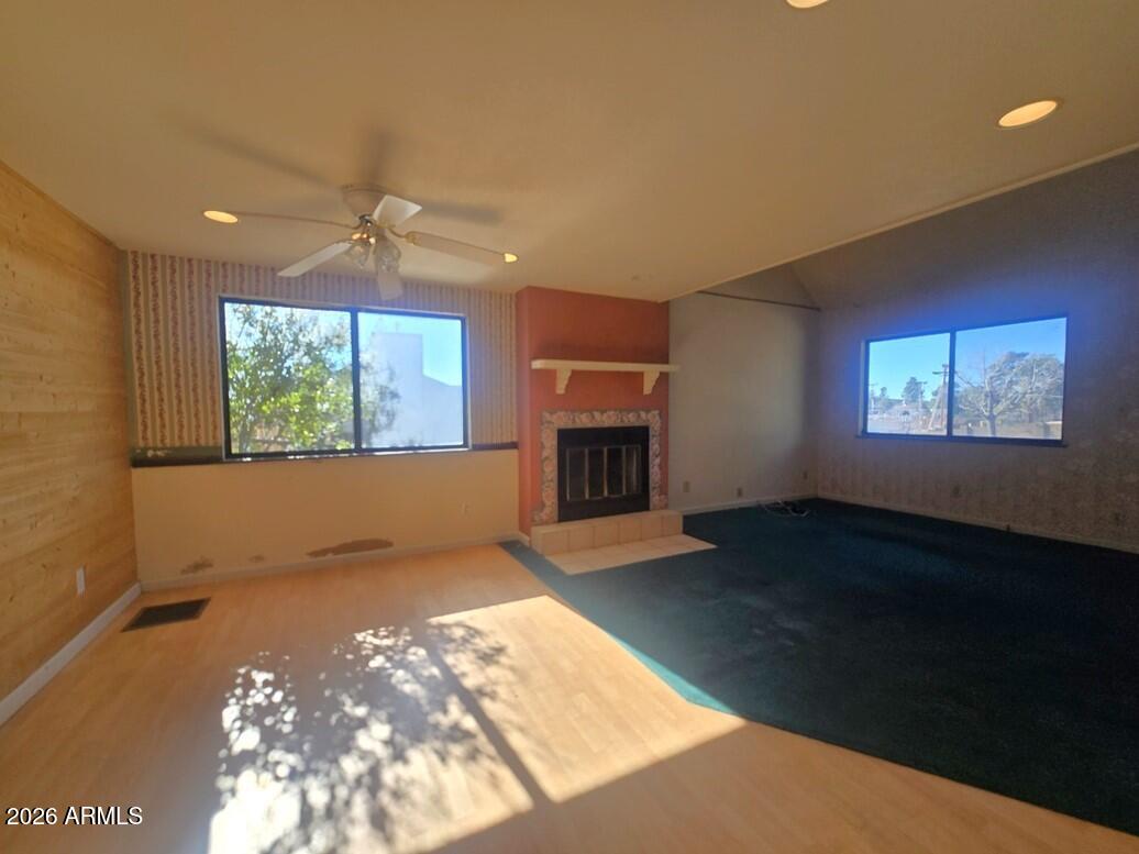 103 South Mc Lane Road Payson, AZ 85541 - Photo 3 of 26 a view of an empty room with a fireplace and a window