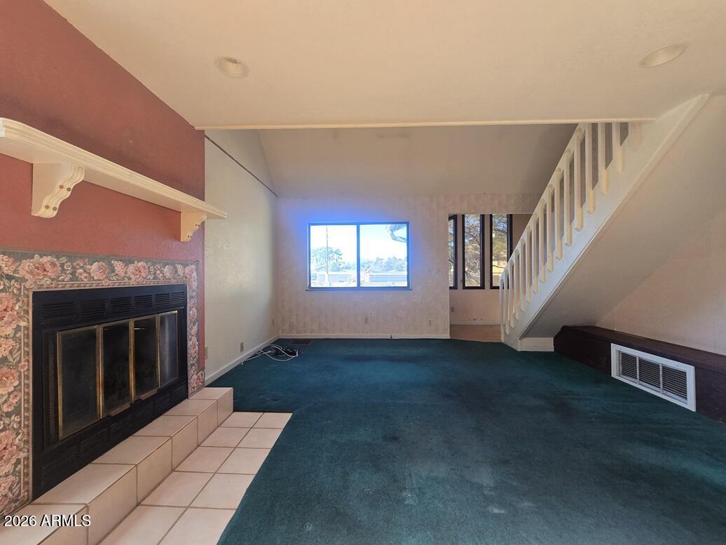 103 South Mc Lane Road Payson, AZ 85541 - Photo 5 of 26 a view of an empty room with wooden floor fireplace and a window