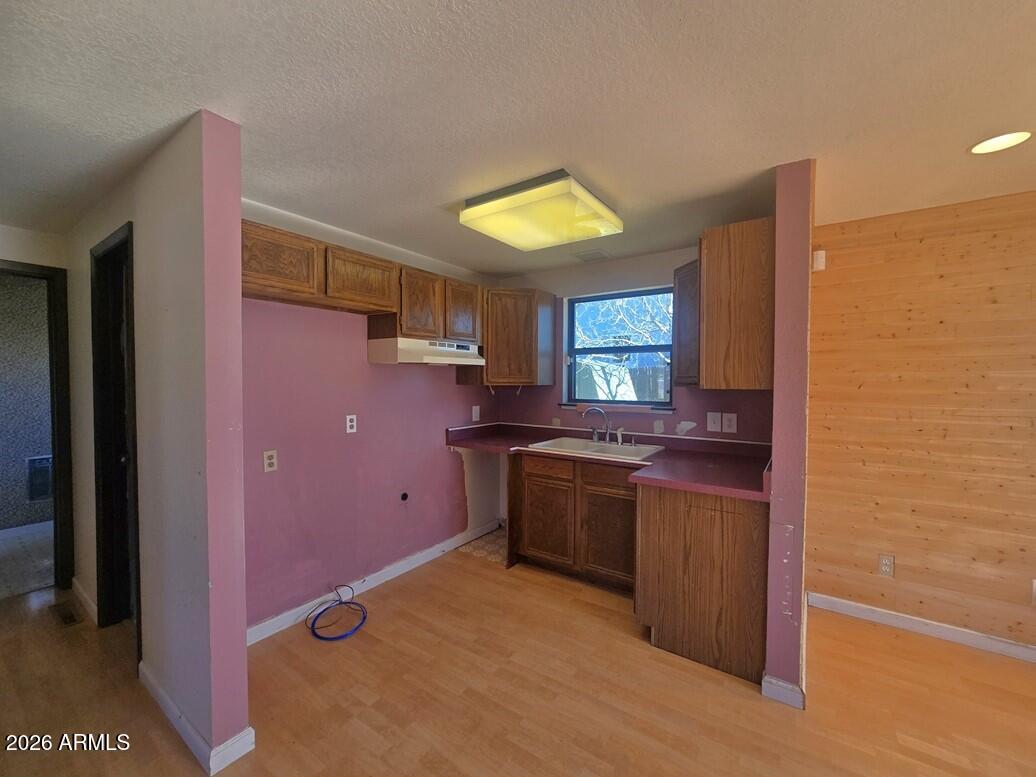 103 South Mc Lane Road Payson, AZ 85541 - Photo 7 of 26 a kitchen with stainless steel appliances granite countertop a stove a sink and a refrigerator