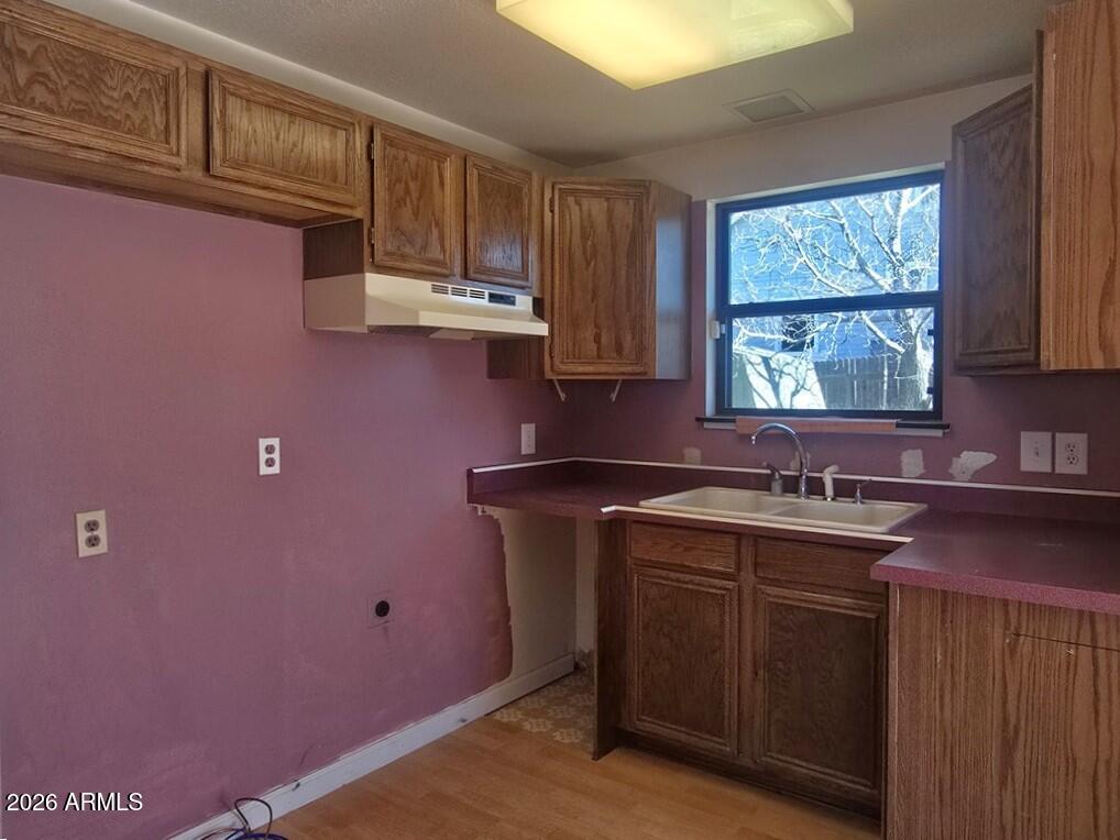103 South Mc Lane Road Payson, AZ 85541 - Photo 8 of 26 a kitchen with a sink cabinets and window