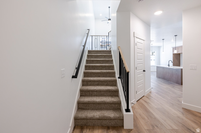 4809 Olive Avenue, Unit 417 Mapleton, UT 84664 - Photo 10 of 18 Stairs featuring ceiling fan, wood finished floors, and recessed lighting