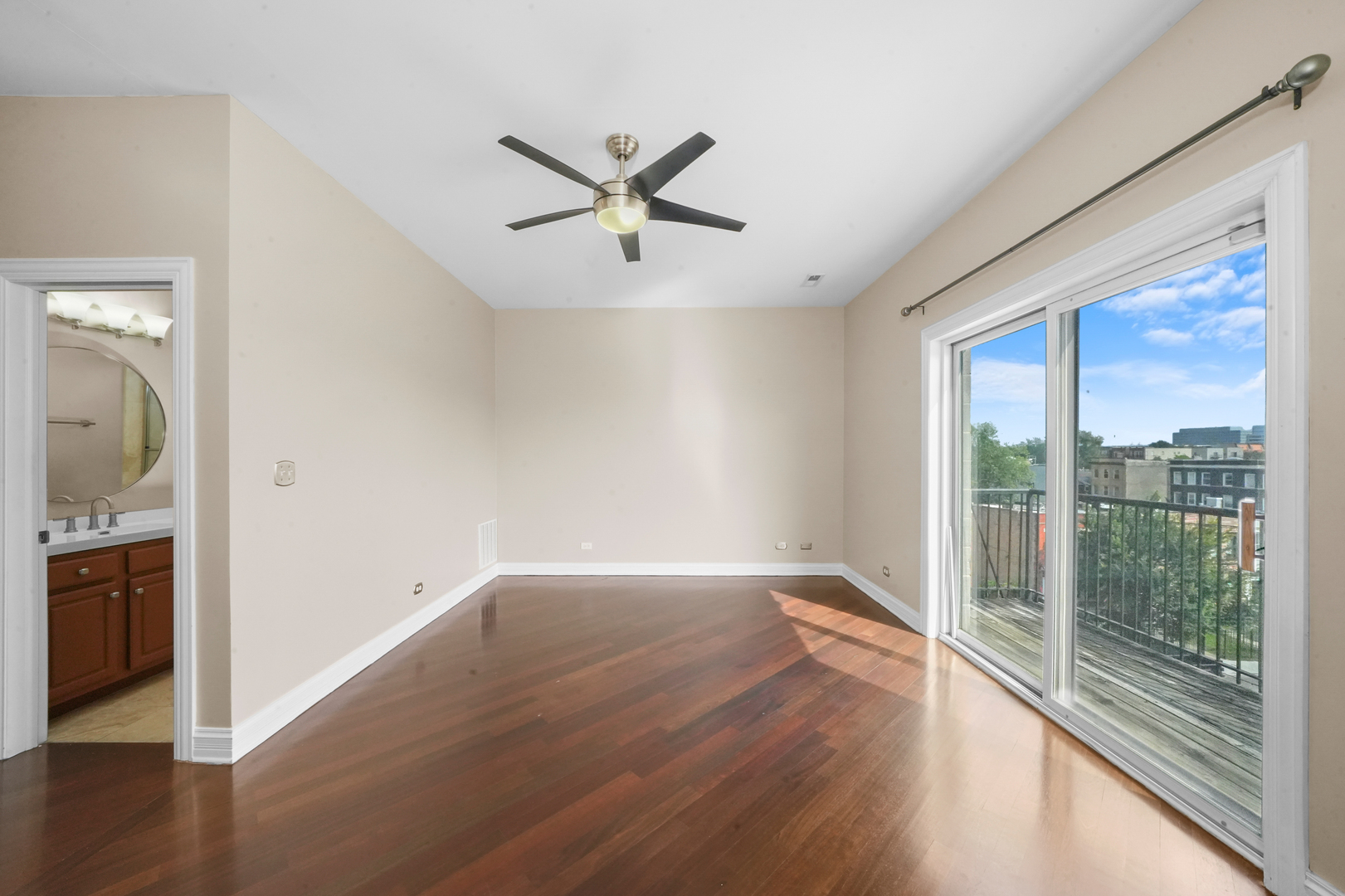 2503 West Harrison Street, Unit 4 Chicago, IL 60612 - Photo 16 of 31 a view of empty room with wooden floor and fan
