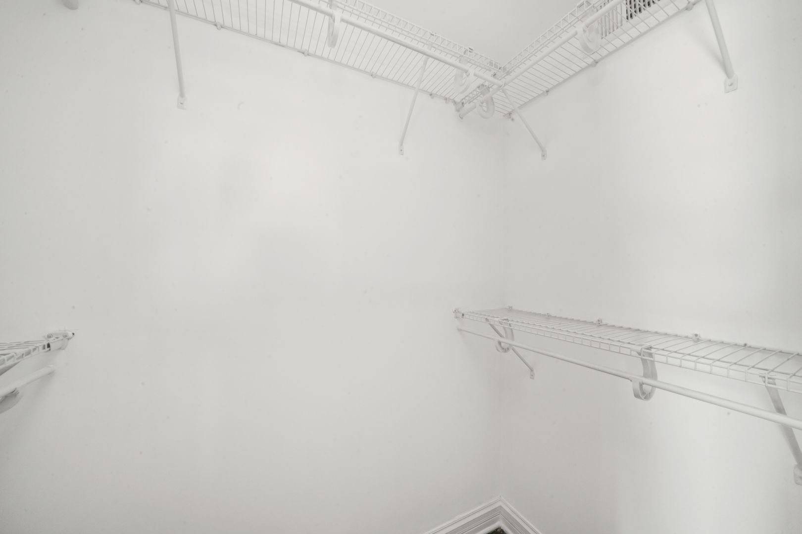2503 West Harrison Street, Unit 4 Chicago, IL 60612 - Photo 20 of 31 a view of a room with racks on the wall