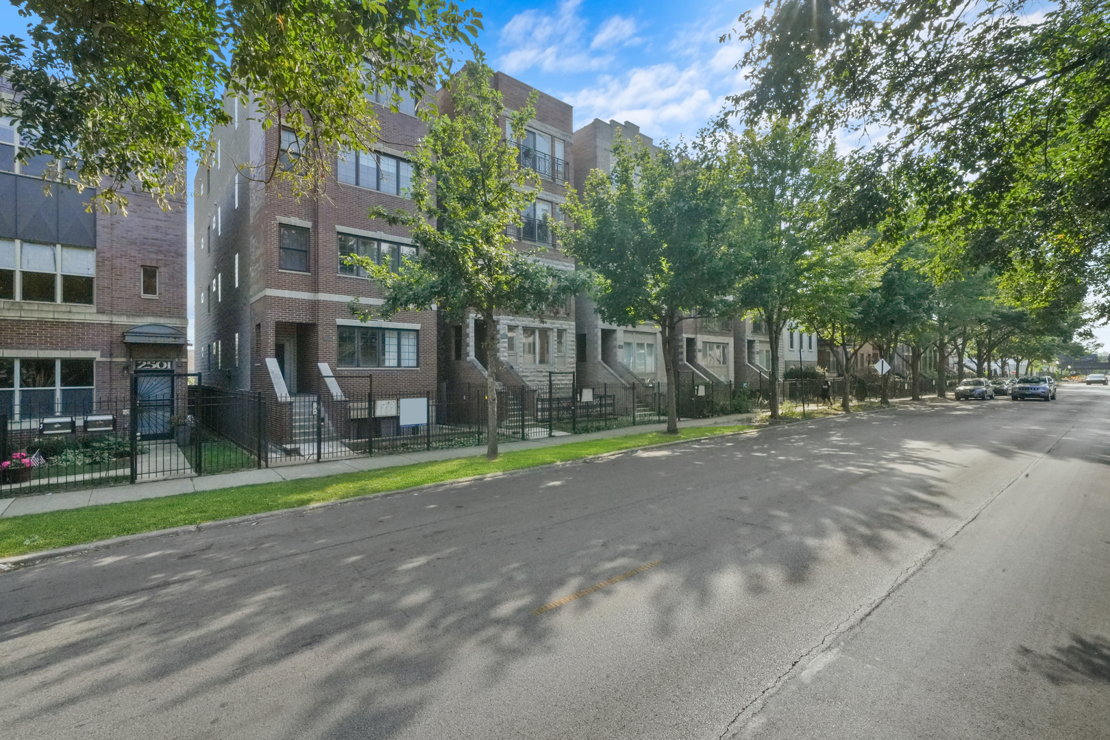 2503 West Harrison Street, Unit 4 Chicago, IL 60612 - Photo 2 of 31 a view of road with yard and trees