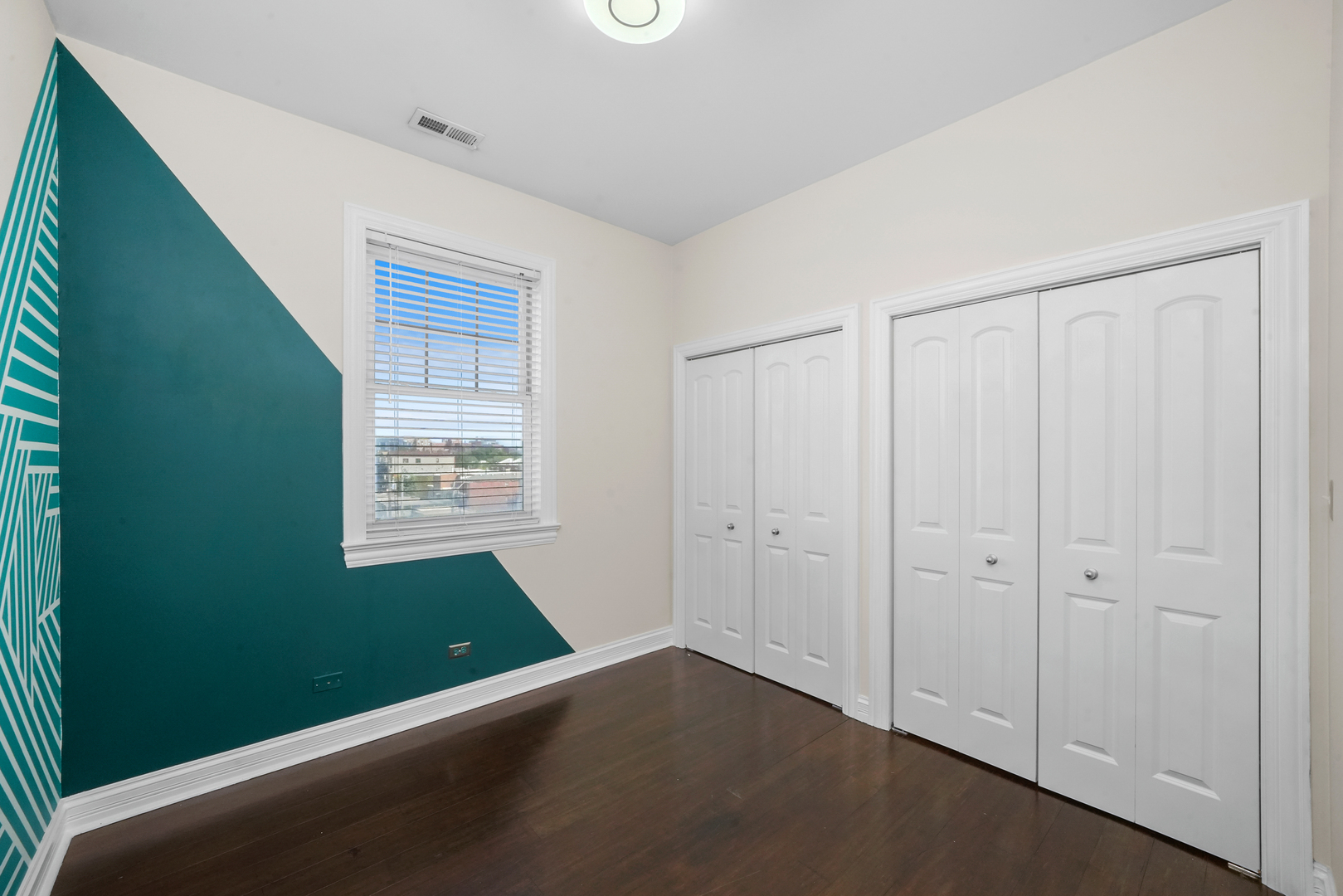 2503 West Harrison Street, Unit 4 Chicago, IL 60612 - Photo 22 of 31 a view of an empty room with window and stairs
