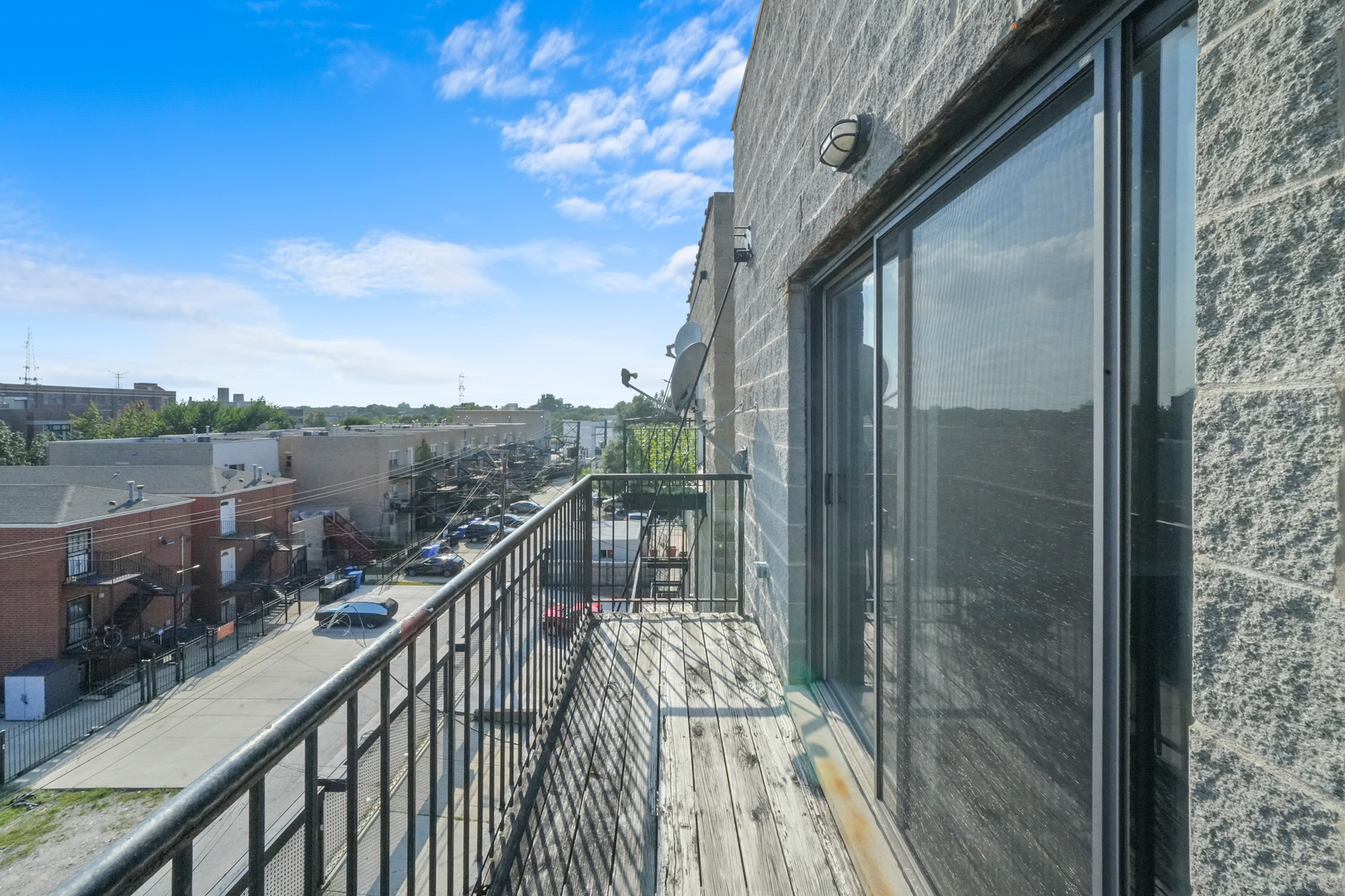 2503 West Harrison Street, Unit 4 Chicago, IL 60612 - Photo 25 of 31 a view of a balcony with wooden floor and fence