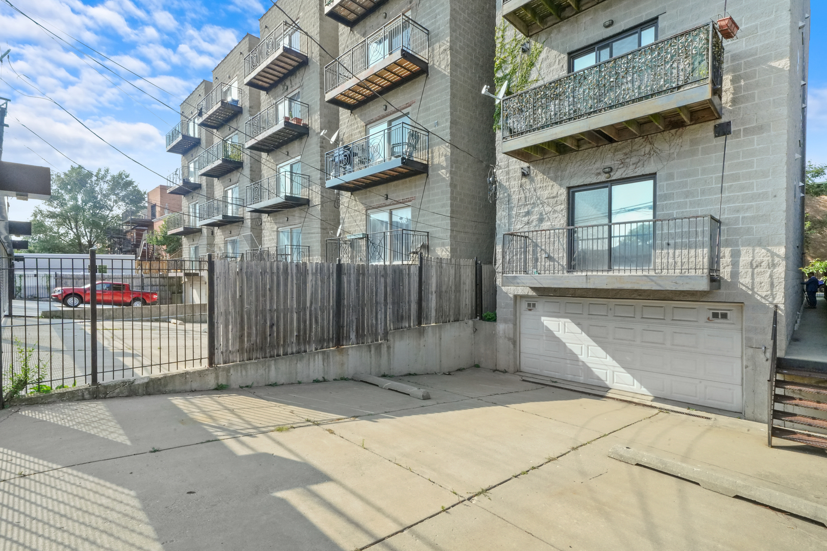 2503 West Harrison Street, Unit 4 Chicago, IL 60612 - Photo 29 of 31 a view of a brick house with many windows