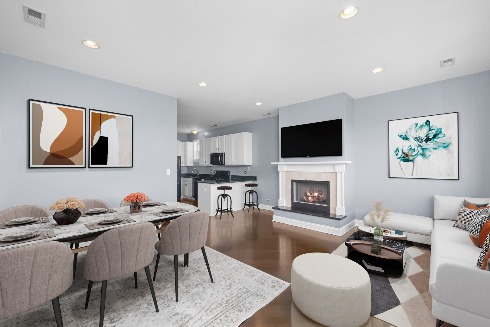 2503 West Harrison Street, Unit 4 Chicago, IL 60612 - Photo 3 of 31 a living room with furniture a fireplace and a flat screen tv