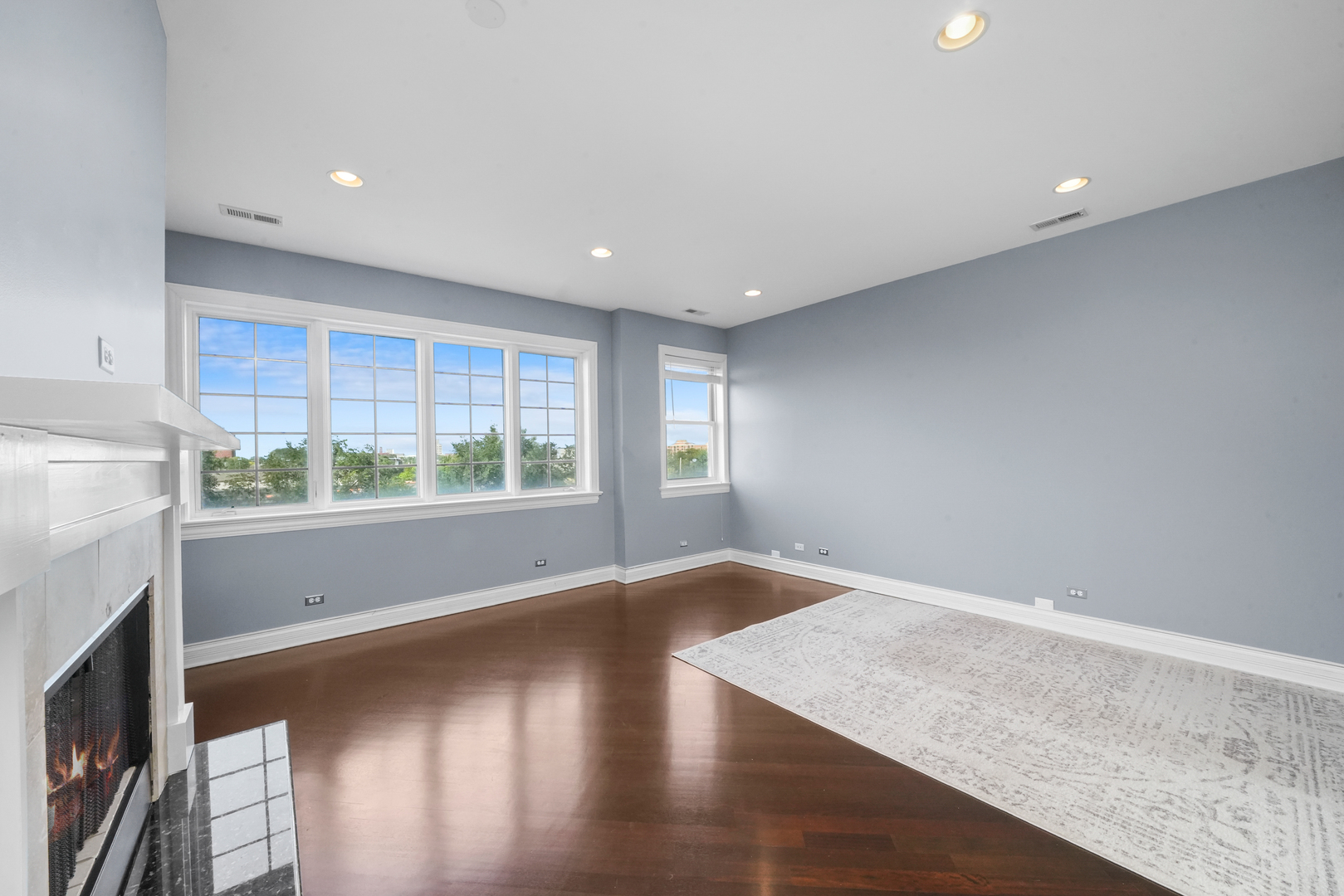 2503 West Harrison Street, Unit 4 Chicago, IL 60612 - Photo 7 of 31 a view of empty room with wooden floor and fan