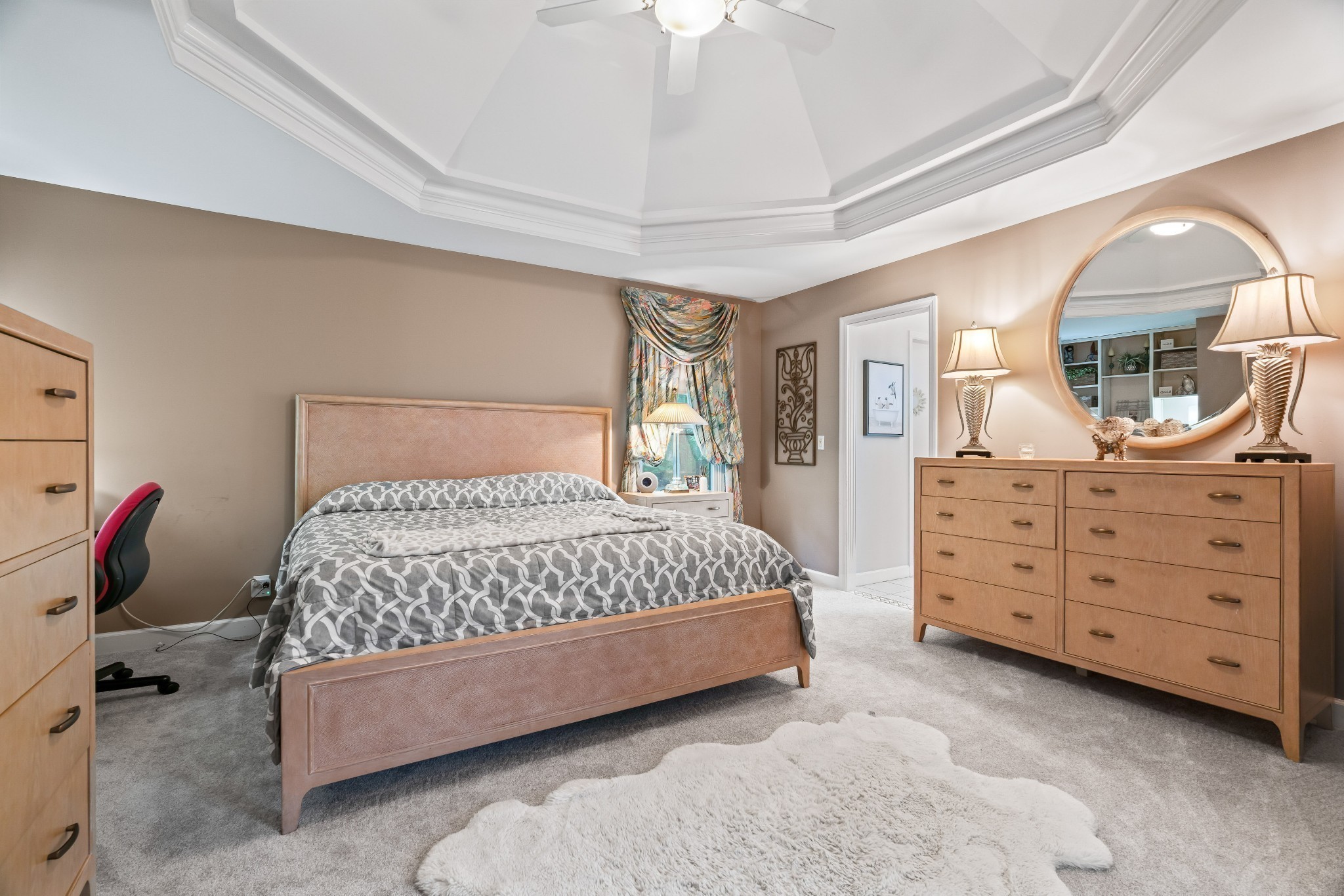 5544 South New Hope Road Hermitage, TN 37076 - Photo 17 of 62 a bedroom with a bed a lamp and a dresser