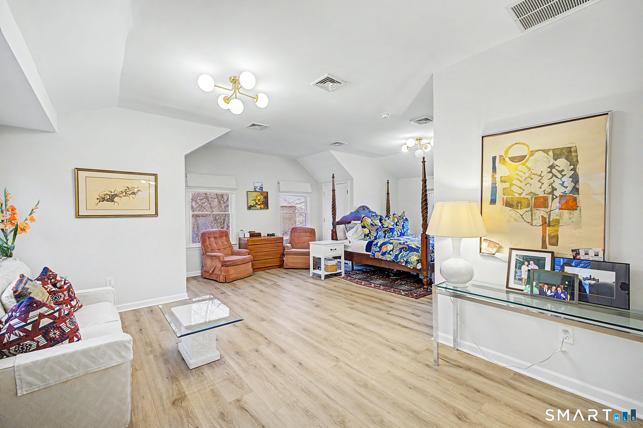 14 Shore Road Danbury, CT 06811 - Photo 18 of 30 a living room with furniture and a chandelier