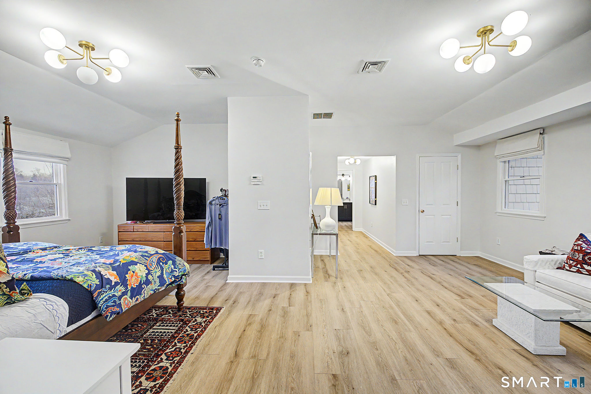 14 Shore Road Danbury, CT 06811 - Photo 19 of 30 a bedroom with a bed and a flat screen tv