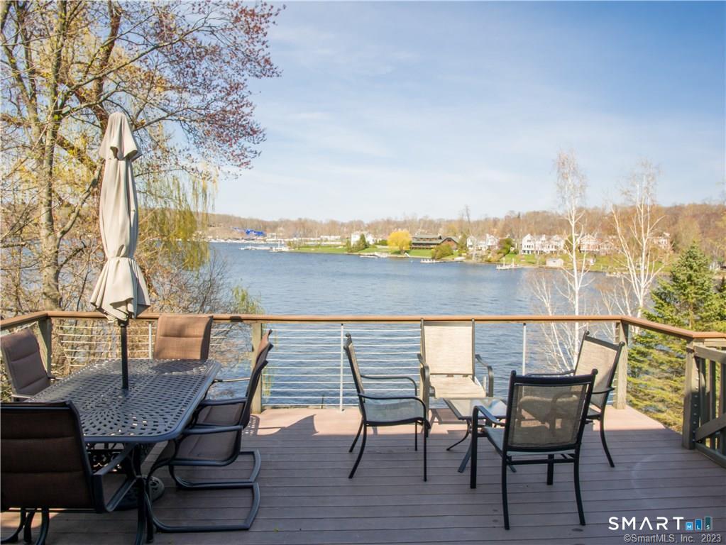 14 Shore Road Danbury, CT 06811 - Photo 2 of 30 a view of a chairs and table on the deck