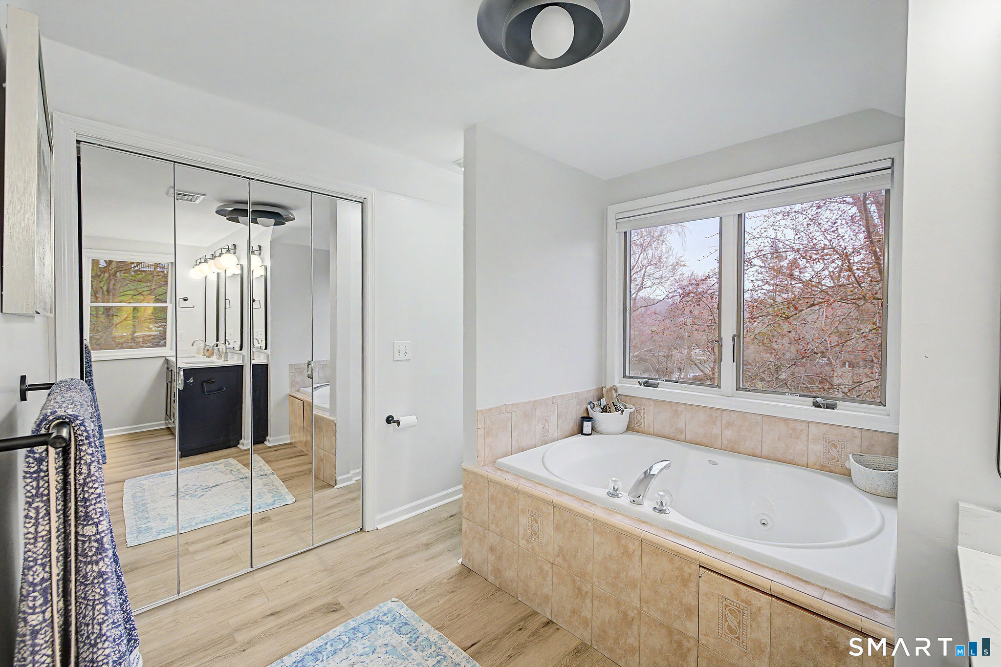 14 Shore Road Danbury, CT 06811 - Photo 21 of 30 a bathroom with a tub a sink and a shower