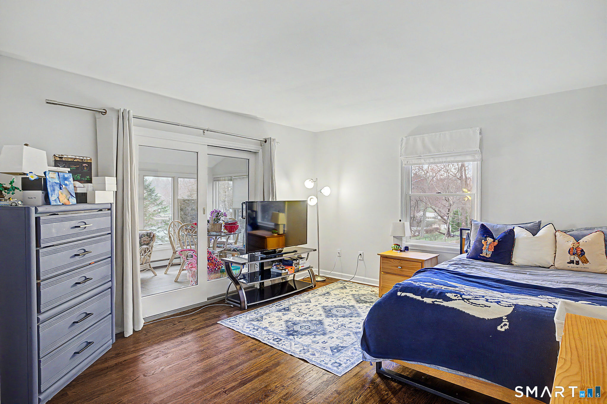 14 Shore Road Danbury, CT 06811 - Photo 24 of 30 a bedroom with furniture and a flat screen tv