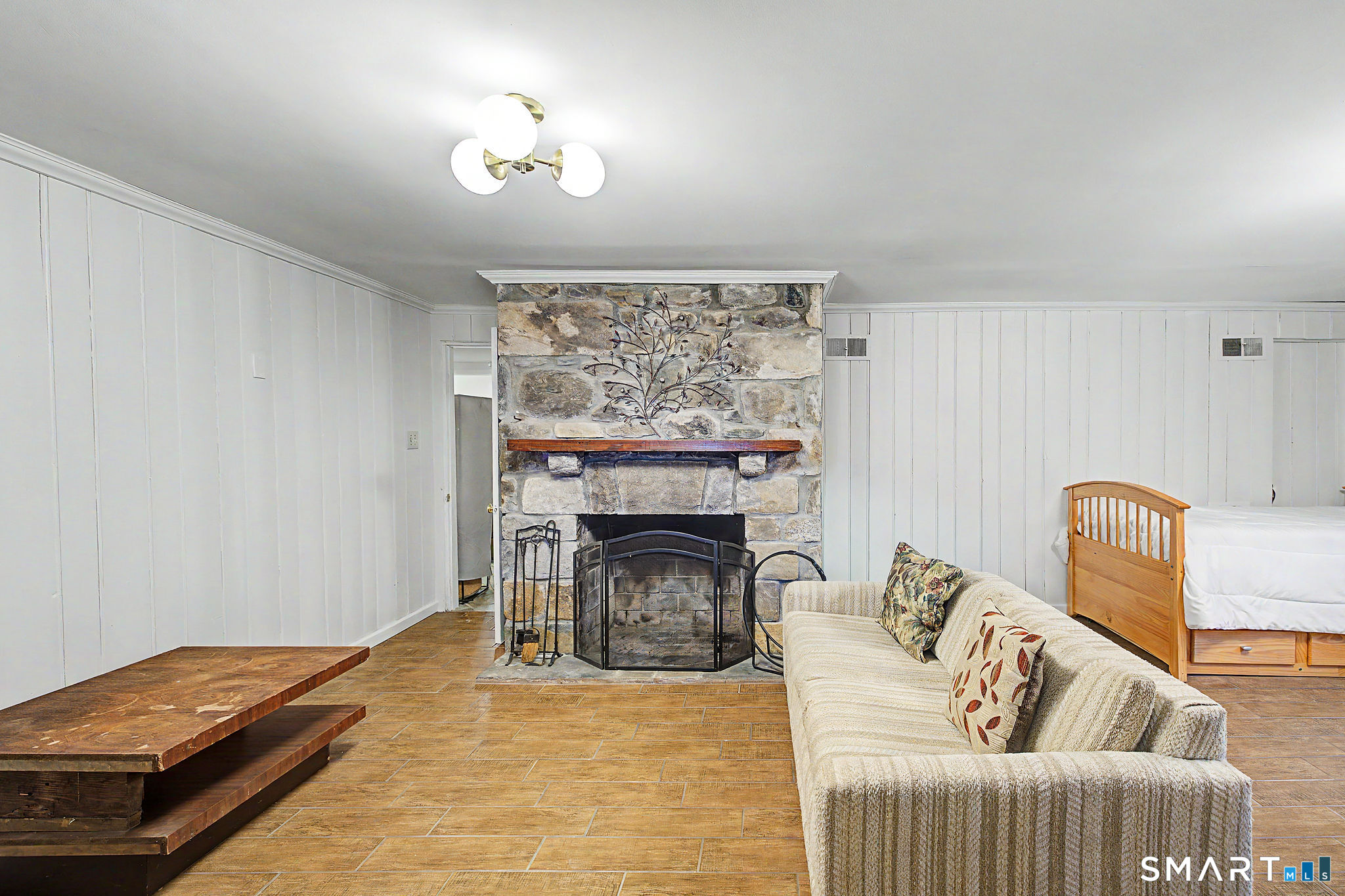 14 Shore Road Danbury, CT 06811 - Photo 25 of 30 a bedroom with furniture and a fireplace