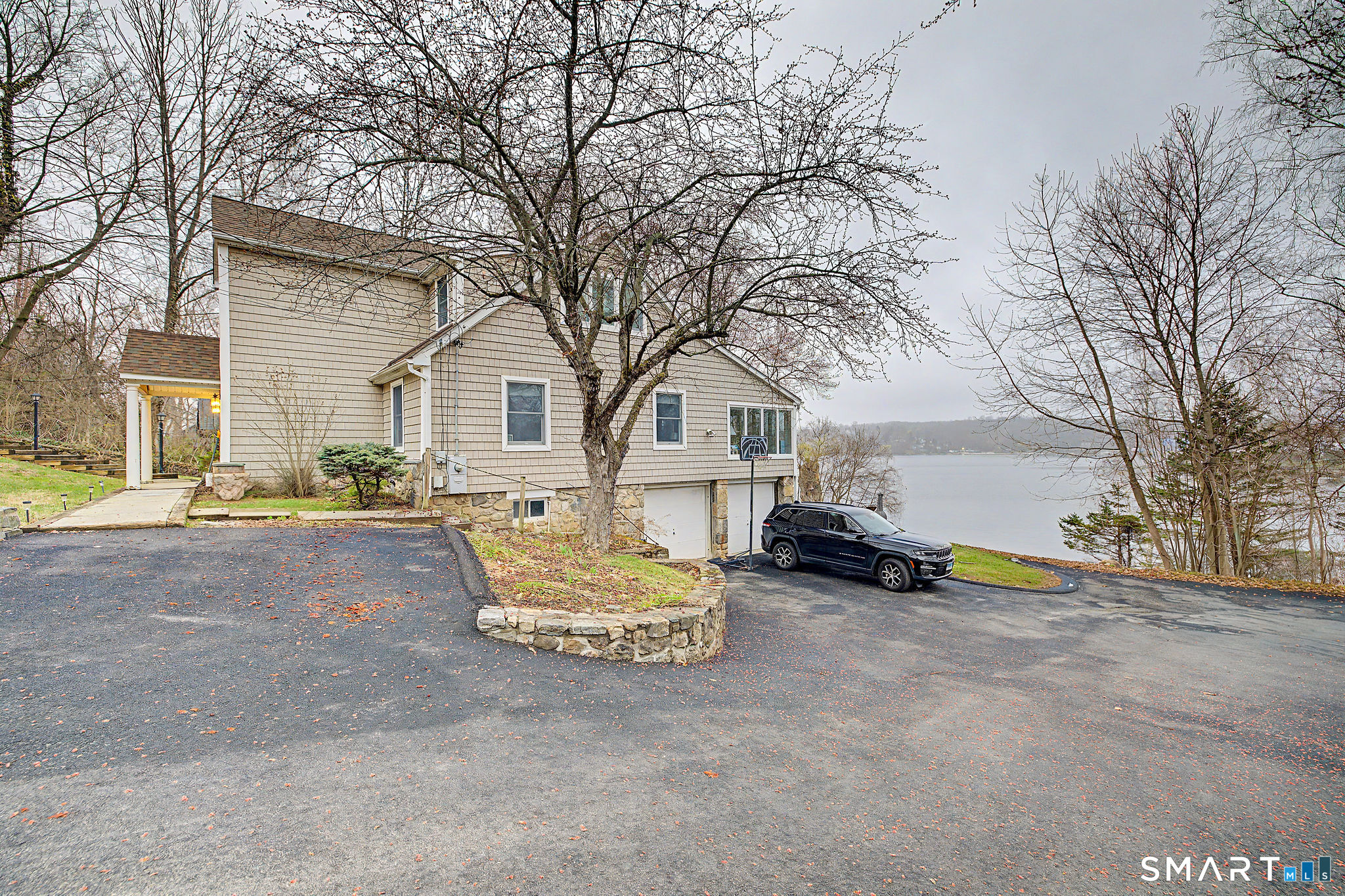 14 Shore Road Danbury, CT 06811 - Photo 7 of 30 a view of a house with a snow and yard