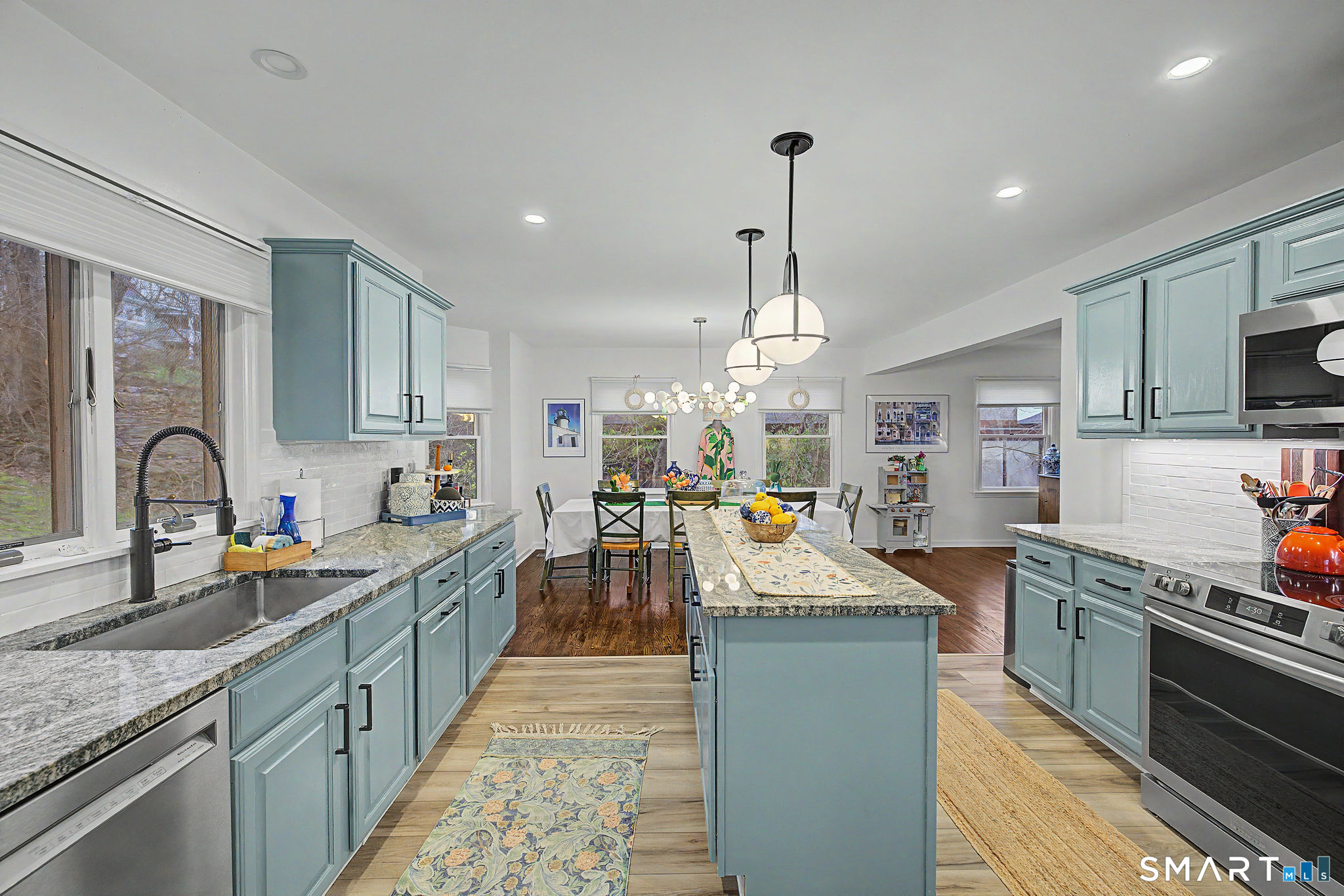 14 Shore Road Danbury, CT 06811 - Photo 10 of 30 a kitchen with stainless steel appliances granite countertop a sink stove and refrigerator