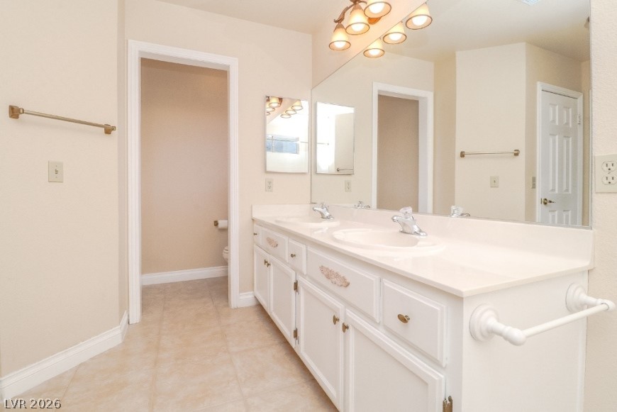 1429 Hawkwood Road Henderson, NV 89014 - Photo 25 of 53 Clean lines and a spacious dual vanity define this functional bathroom layout.