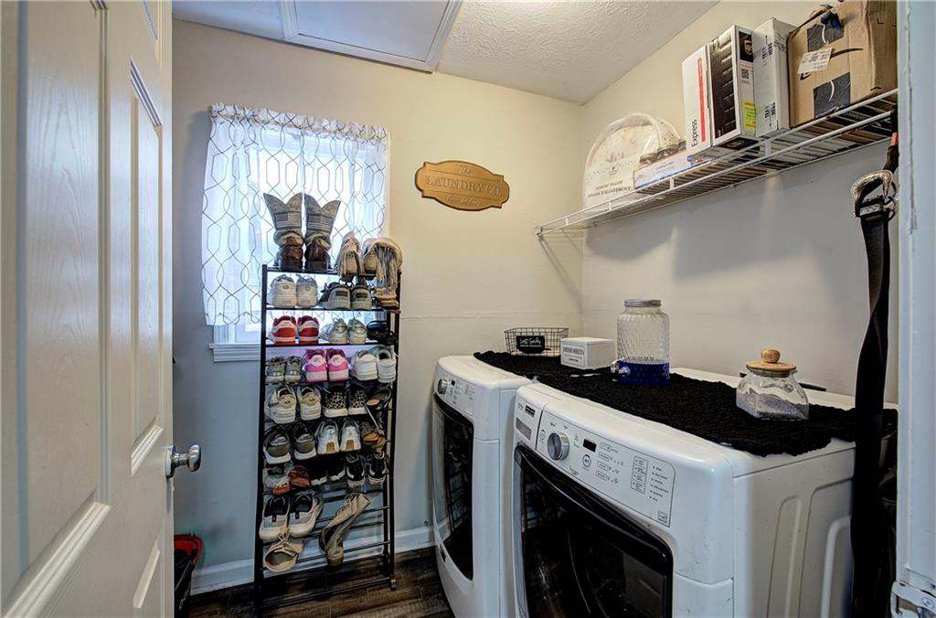 413 Calhoun Avenue Northeast Rome, GA 30161 - Photo 12 of 27 a kitchen with stainless steel appliances granite countertop a sink and cabinets