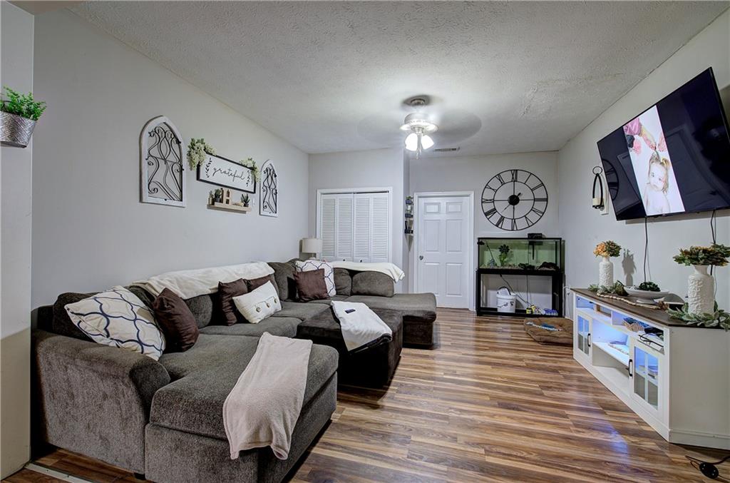 413 Calhoun Avenue Northeast Rome, GA 30161 - Photo 13 of 27 a living room with furniture and a flat screen tv