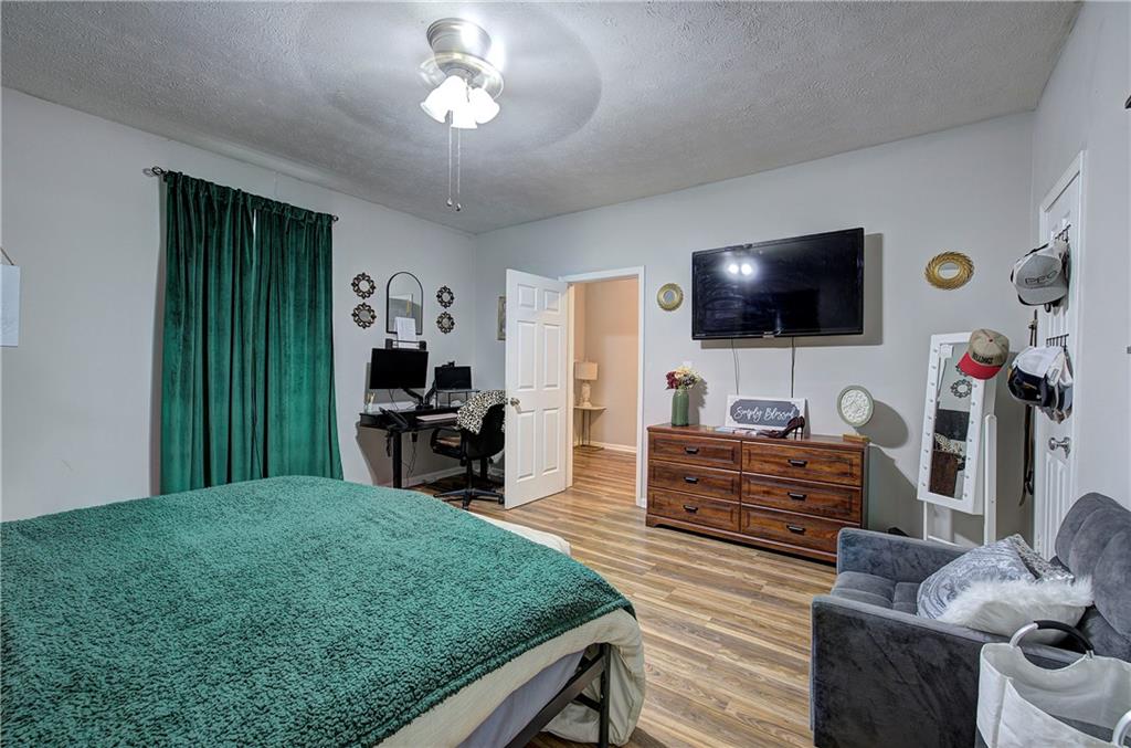 413 Calhoun Avenue Northeast Rome, GA 30161 - Photo 22 of 27 a living room with furniture and a flat screen tv