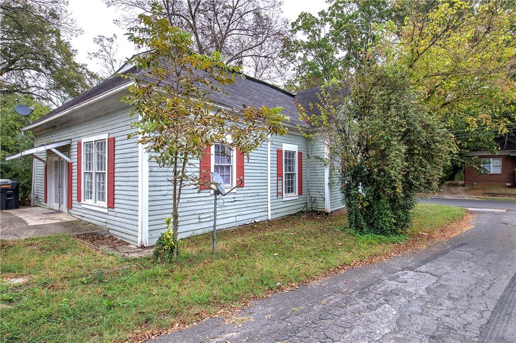 413 Calhoun Avenue Northeast Rome, GA 30161 - Photo 24 of 27 a view of a house with a yard and tree