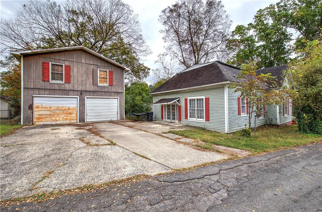 413 Calhoun Avenue Northeast Rome, GA 30161 - Photo 25 of 27 a view of a house with a yard and large tree