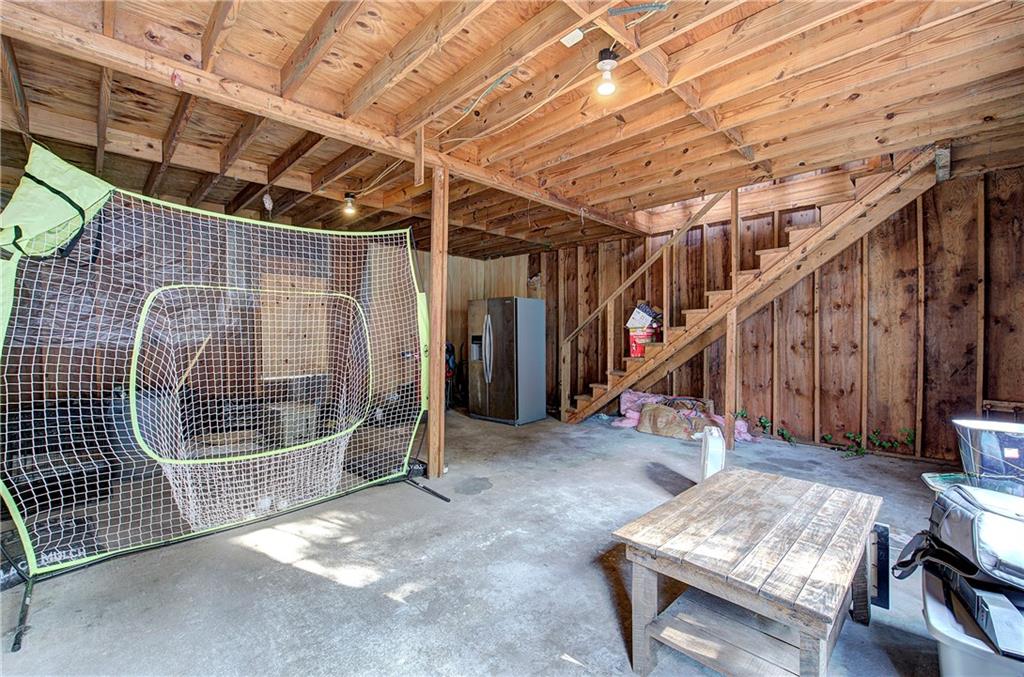 413 Calhoun Avenue Northeast Rome, GA 30161 - Photo 26 of 27 a view of an empty room with wooden floor
