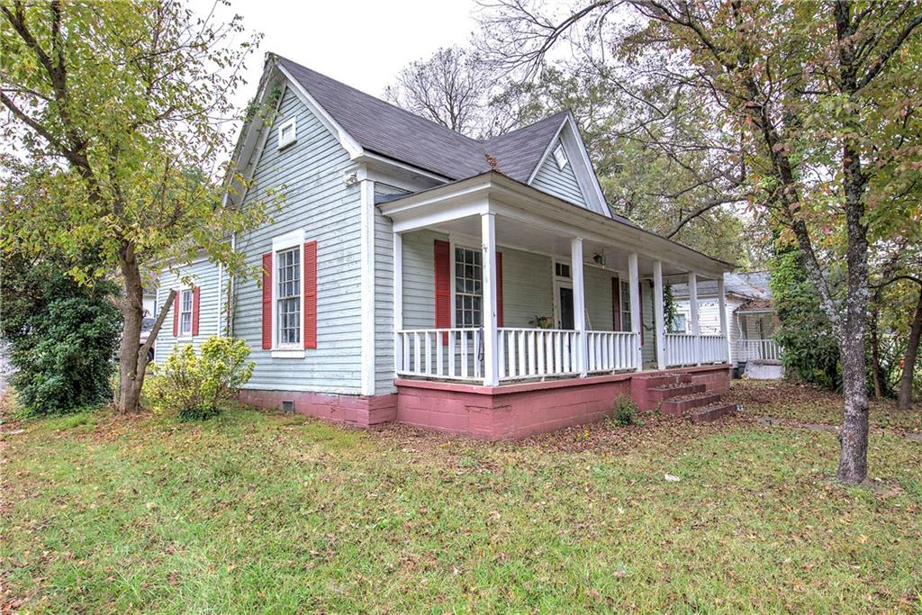 413 Calhoun Avenue Northeast Rome, GA 30161 - Photo 3 of 27 a front view of a house with garden