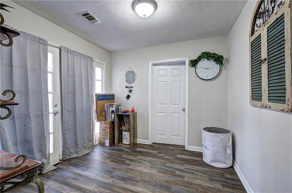 413 Calhoun Avenue Northeast Rome, GA 30161 - Photo 6 of 27 a view of room with window and wooden floor