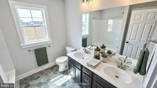 a bathroom with a sink toilet and mirror