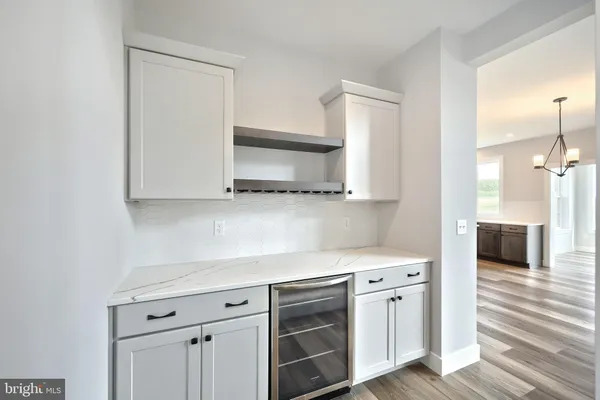 a kitchen with stainless steel appliances white cabinets and a sink