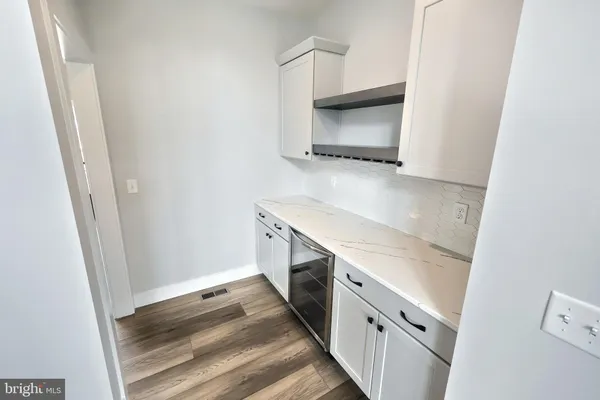 a bathroom with a sink and a microwave